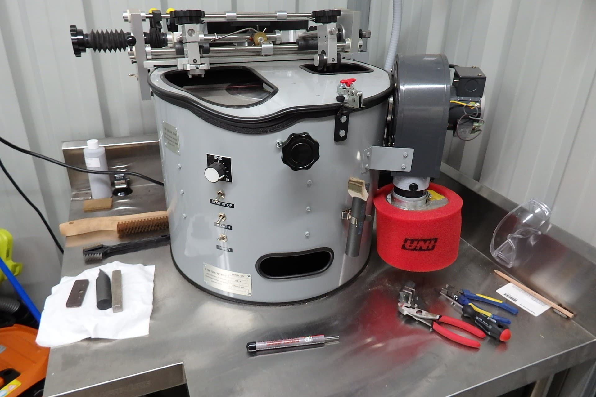 Automated clipper blade sharpening machine used for A5, wide and large-animal blades.