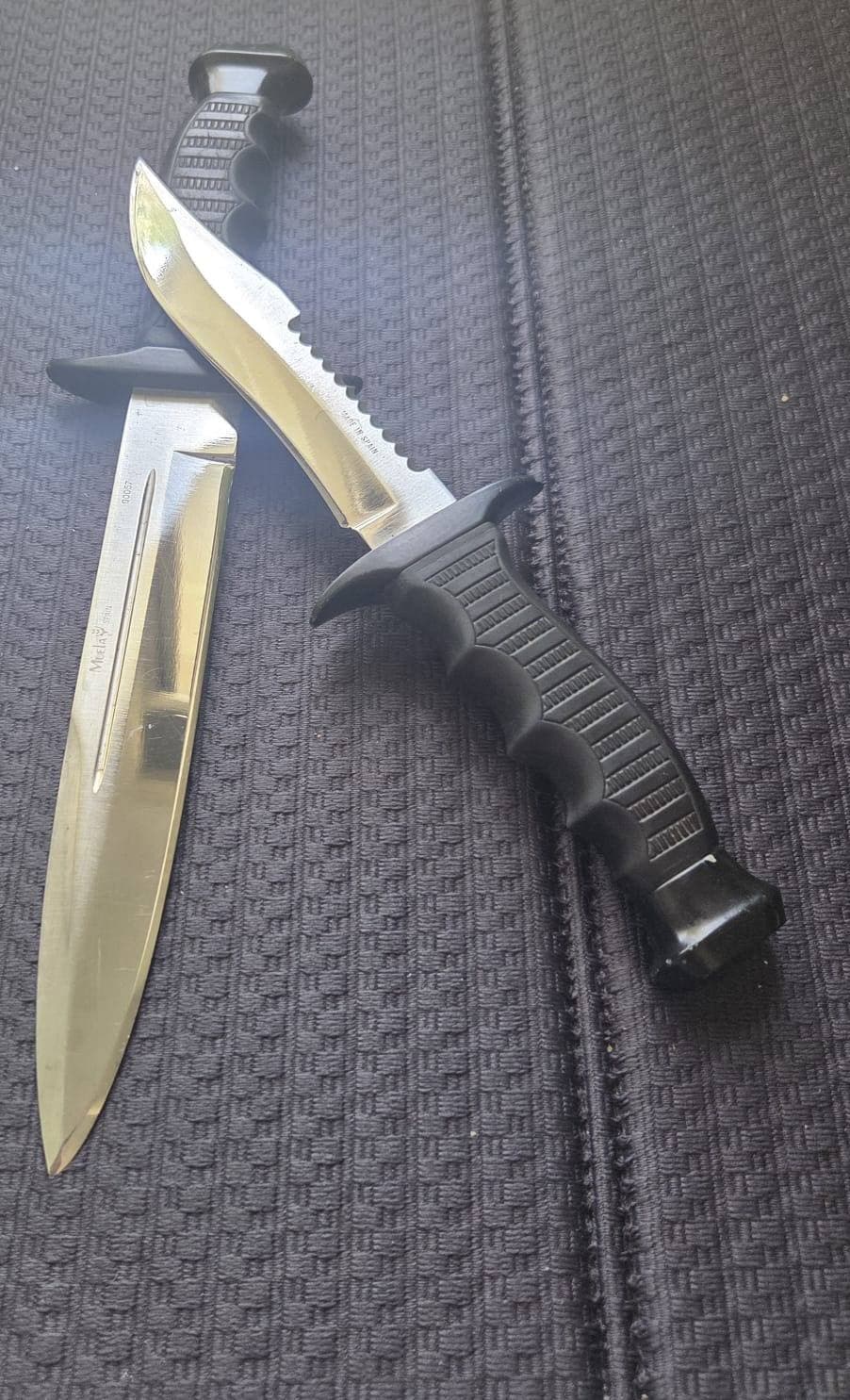 Two hunting knives with mirror-bright blades after sharpening at Xtra Sharp, Campbelltown NSW.