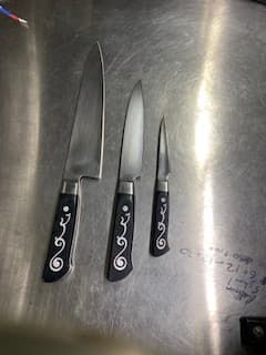 Professional knife set prepared for sharpening.