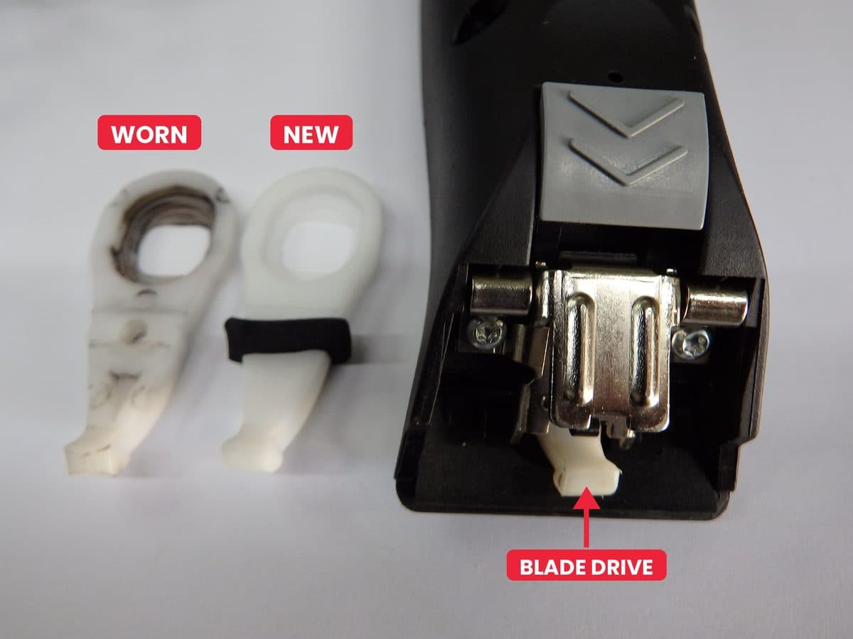 A worn and a new animal clipper blade drive next to a clipper with the blade removed, with an arrow showing where the blade drive sits