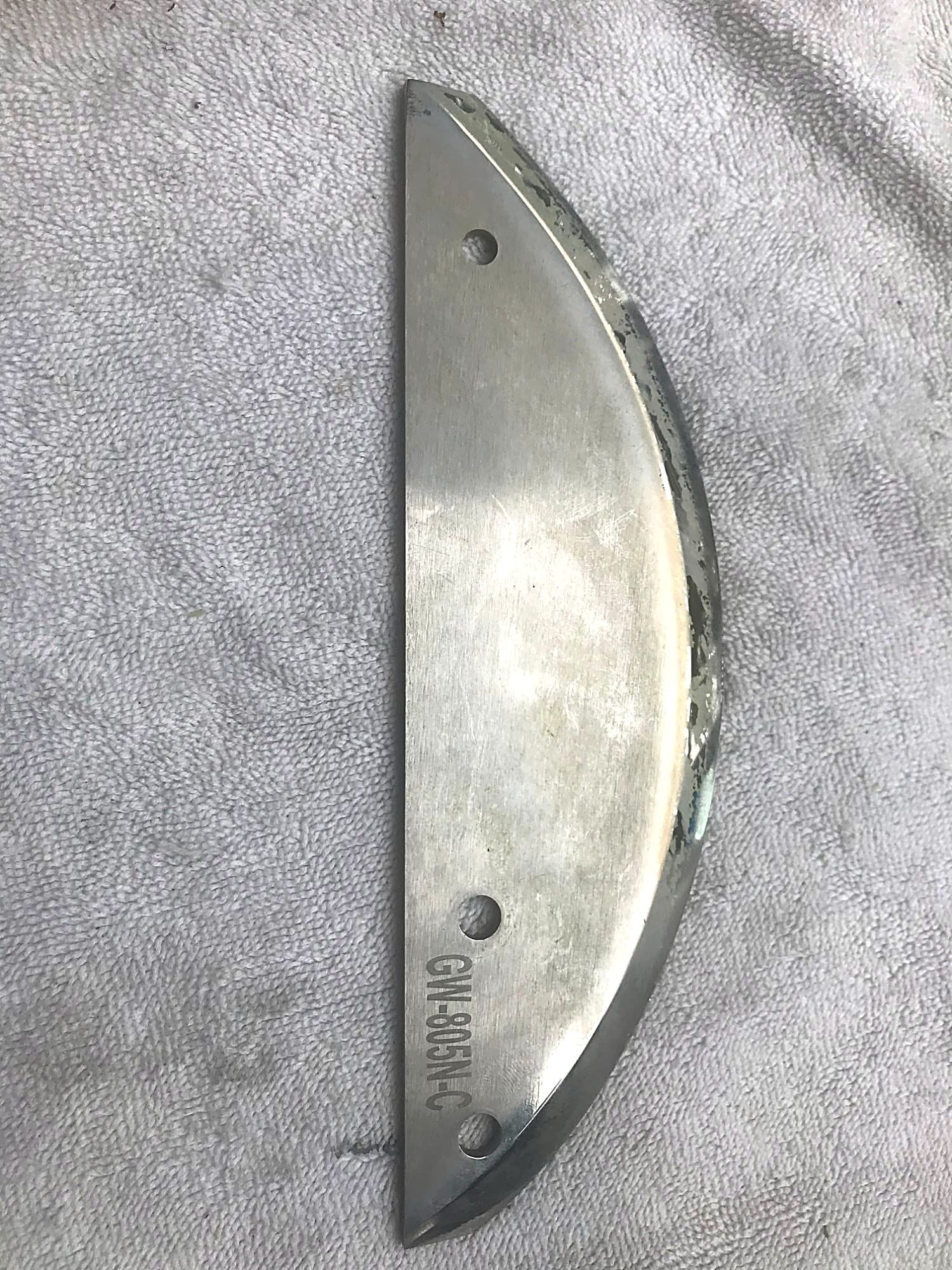 Processor blades before sharpening — visible wear along the cutting edge.